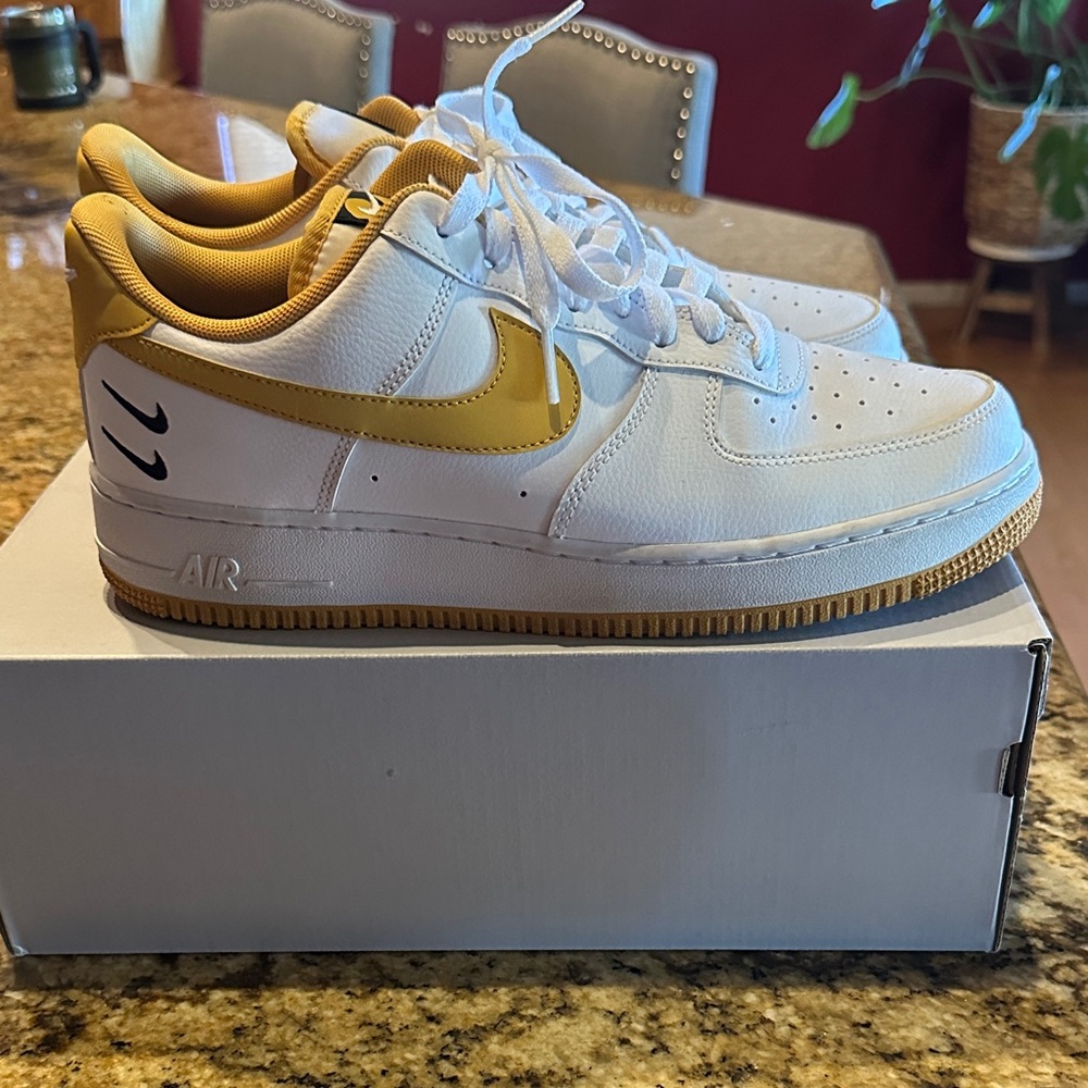 Nike Air Force 1 White and Gold Sneakers